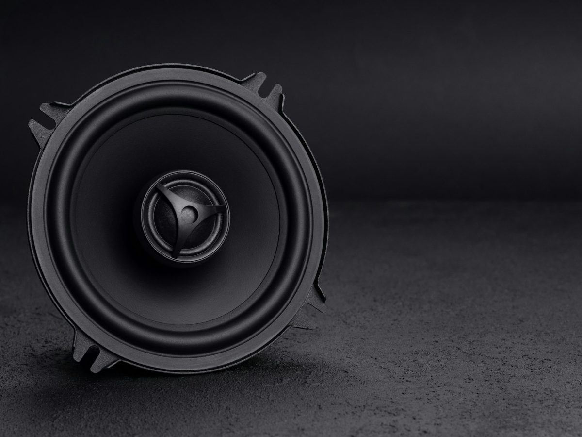 Car audio speaker on dark background