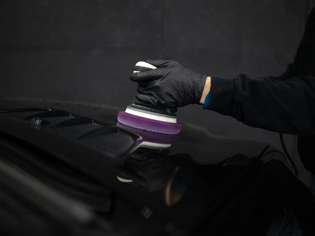 Detailing master polishes the car