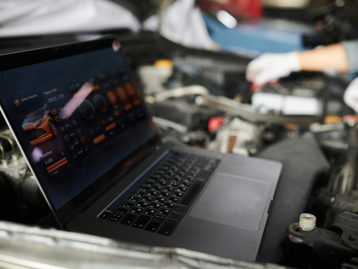 Mechanics Analyzing Car Computer System